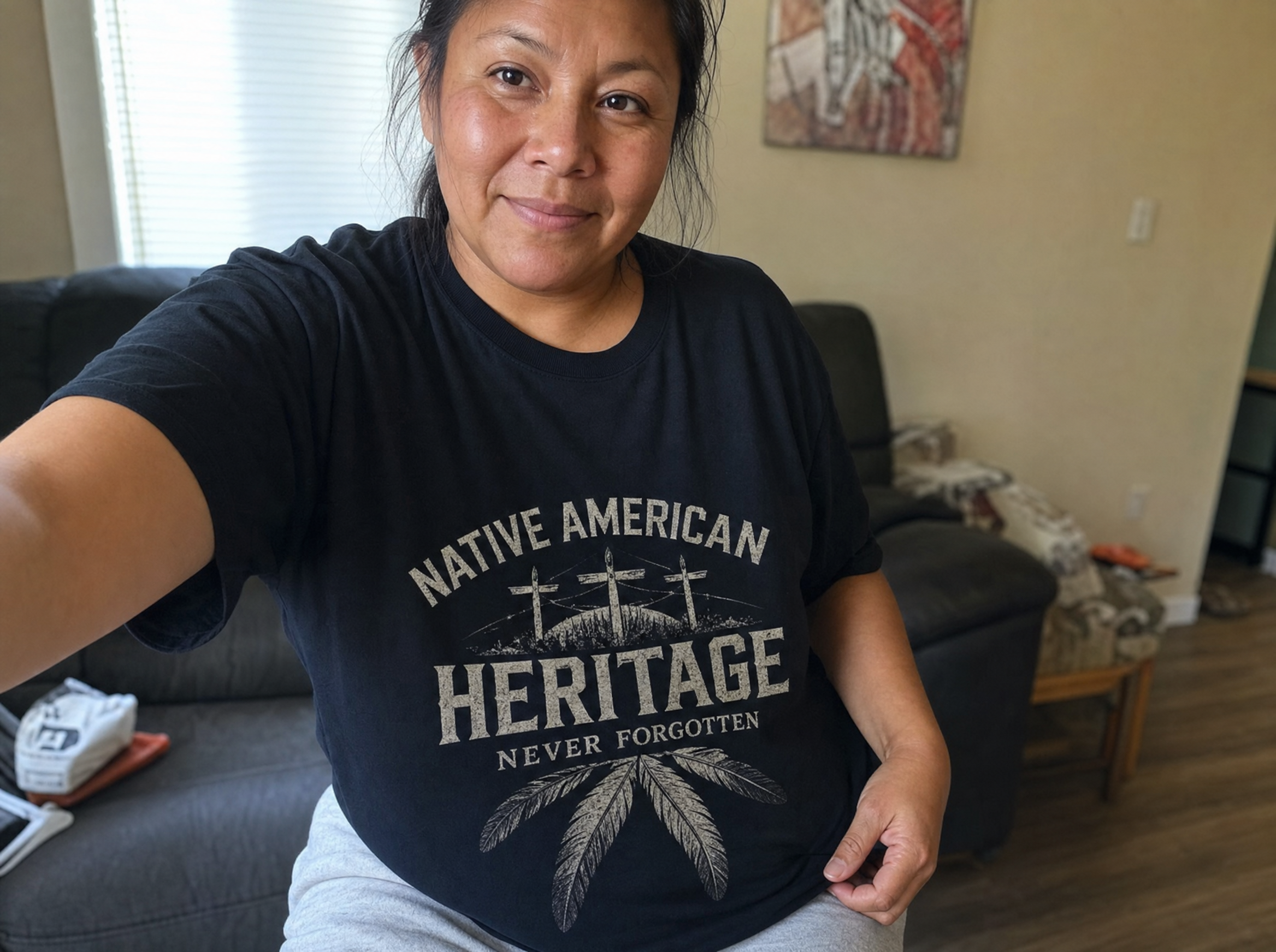 Customer wearing a Native American heritage tee at home