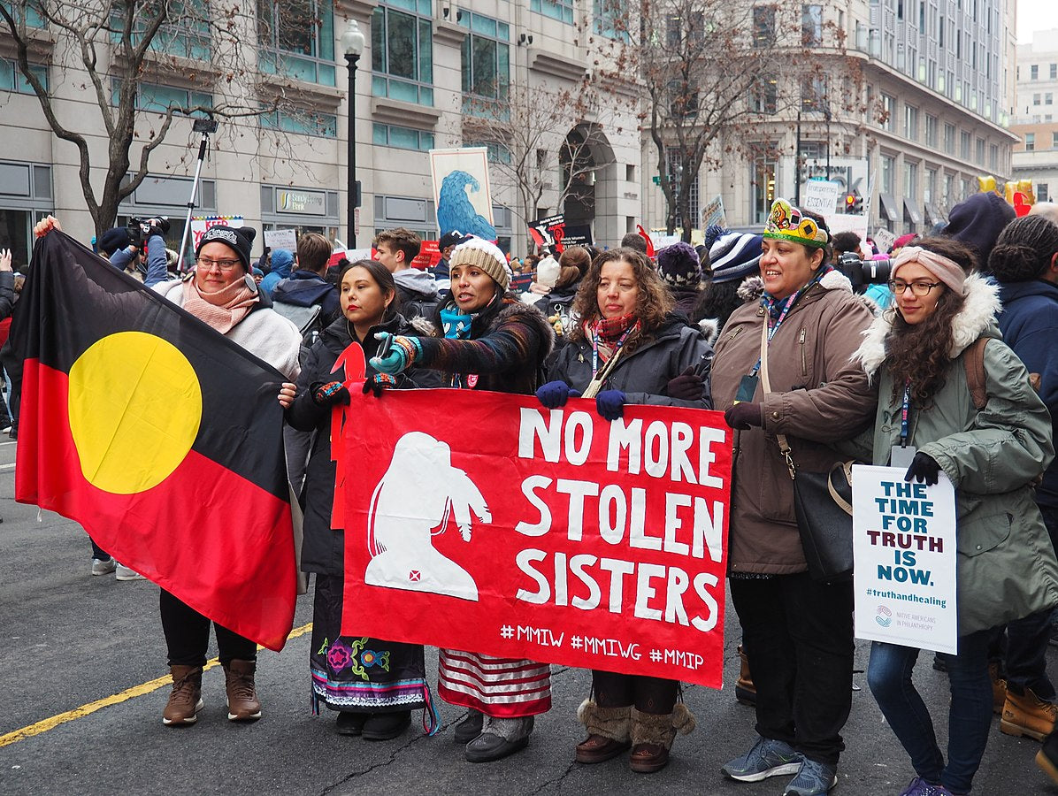 Present-day Indigenous rights demonstration carrying banners