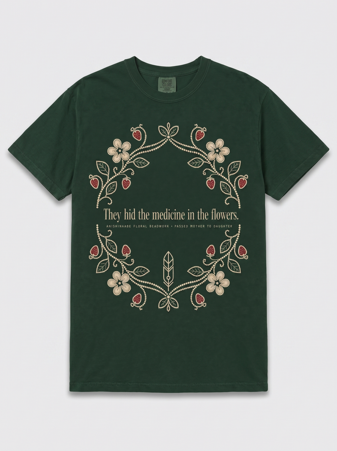 Medicine in the Flowers — forest green Anishinaabe heritage tee, full front print