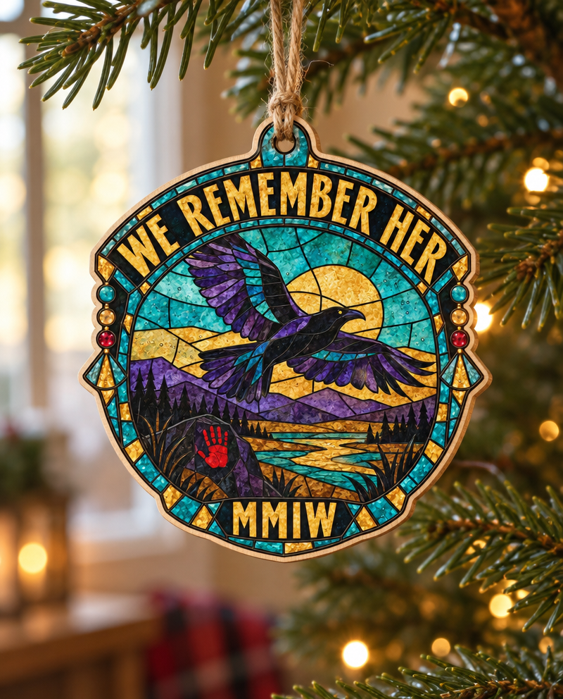 Glass Sky We Remember Her wooden ornament, hanging on a tree